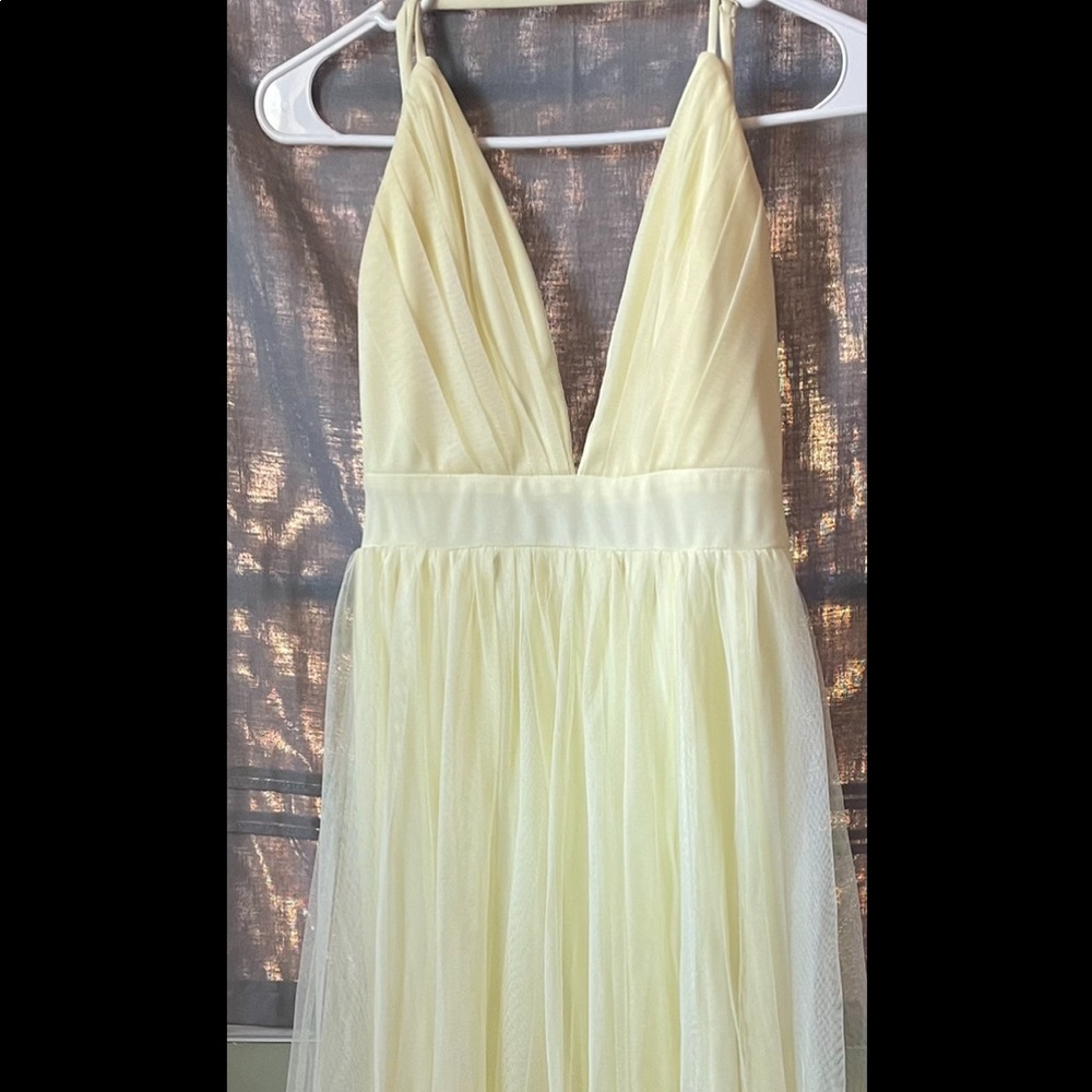 Long pastel yellow flowey dress